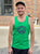 a person wearing a green tank top with The Herbivorous Butcher logo on it