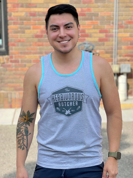 person wearing a grey tank top that has a light blue trim and has The Herbivorous Butcher logo on it