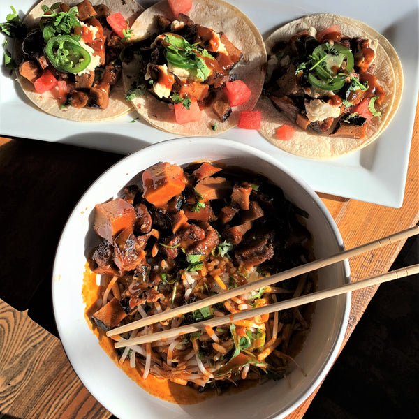 bowl of noodles with veggies and plant based ribs with vegan tacos