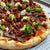 vegan pizza with plant based meats and broccoli