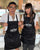 a brother and sister wearing black aprons with The Herbivorous Butcher logo