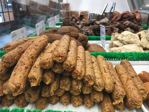 links of vegan Italian sausage in a vegan meat case