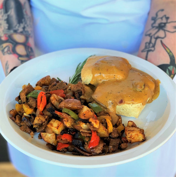 photo of vegan biscuits and gravy with a side of breakfast hash